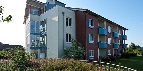 Senior complex with large window fronts and balconies